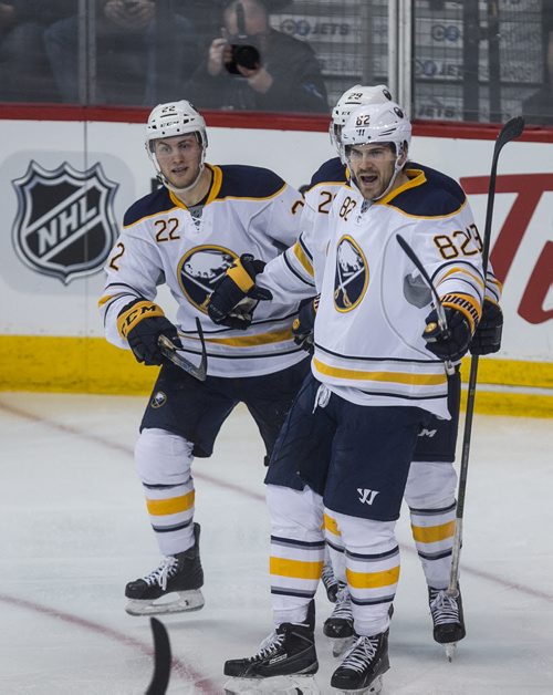 Buffalo Sabres' Marcus Foligno (82) celebrates after scoring the teams fifth goal the game in the third period with team-mates Johan Larsson (22) and Jake McCabe (29) of NHL action against the Winnipeg Jets in Winnipeg on Sunday, January 10, 2016. 160110 - Sunday, January 10, 2016 -  MIKE DEAL / WINNIPEG FREE PRESS