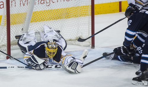 Buffalo Sabres' goaltender Linus Ullmark (35) makes a save from a rebound by Winnipeg Jets' Chris Thorburn (22) during third period NHL action in Winnipeg on Sunday, January 10, 2016. 160110 - Sunday, January 10, 2016 -  MIKE DEAL / WINNIPEG FREE PRESS