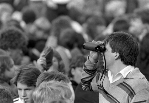 A fan uses binoculars to get a closer look during the David Bowie concert on September 14, 1983. Glenn Olsen / Winnipeg Free Press
