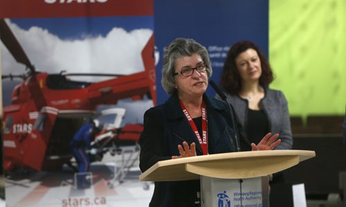 At the podium is Betty Lou Rock, Director, STARS with Health Minister Sharon Blady at the announcement Tuesday regarding the upcoming opening of the Helipad atop the roof of the Diagnostic Centre of Excellence at HSC Winnipeg.  Larry Kusch story Wayne Glowacki / Winnipeg Free Press Jan. 12 2016