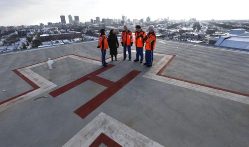Health Minister Sharon Blady with STARS crew members from left, Sarah Painter, Flight Nurse, Ray Rempel, Flight Paramedic, Paul Adams, Pilot and Dave Harding, Pilot on the the Helipad atop the roof of the Diagnostic Centre of Excellence at HSC Winnipeg that will be in use late spring.  Larry Kusch story Wayne Glowacki / Winnipeg Free Press Jan. 12 2016