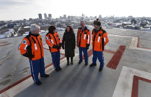 Health Minister Sharon Blady with STARS crew members from left, Dave Harding, Pilot, Sarah Painter, Flight Nurse, Ray Rempel, Flight Paramedic and Paul Adams, Pilot on the the Helipad atop the roof of the Diagnostic Centre of Excellence at HSC Winnipeg that will be in use late spring .  Larry Kusch story Wayne Glowacki / Winnipeg Free Press Jan. 12 2016