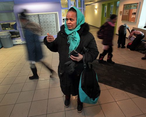 Zewdi Habtmichael waits in the lobby of her refugee housing apartment building to meet her children as they return from school. She's just returned from her own english classes. See Carol Sander's story. January 12, 2016 - (Phil Hossack / Winnipeg Free Press)