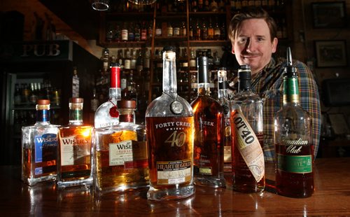 Tim Roth, Manager of the Toad in the Hole Pub on Osborne St. in the Whiskey Bar with some of their premium Canadian whiskeys. Al Small story Wayne Glowacki / Winnipeg Free Press Jan. 13 2016