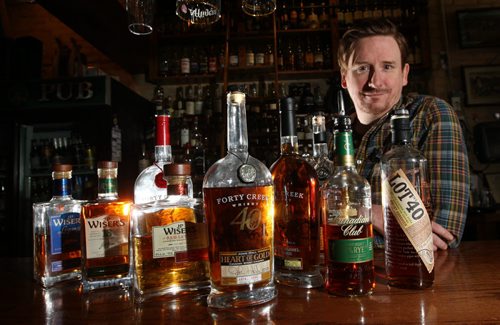Tim Roth, Manager of the Toad in the Hole Pub on Osborne St. in the Whiskey Bar with some of their premium Canadian whiskeys. Al Small story Wayne Glowacki / Winnipeg Free Press Jan. 13 2016