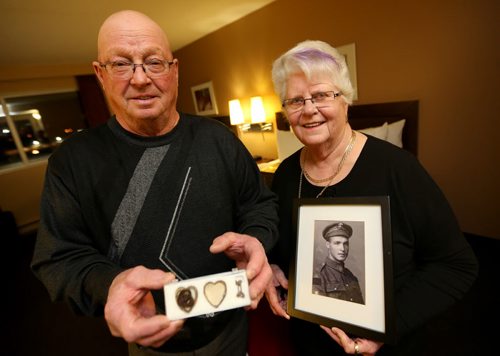 Jim and Patricia Halliday, from near Boissevain, with a locket that belonged to Private Sidney Halliday, who was killed in the First World War and will have a lake named in his honour, Wednesday, January 13, 2016. (TREVOR HAGAN/WINNIPEG FREE PRESS)