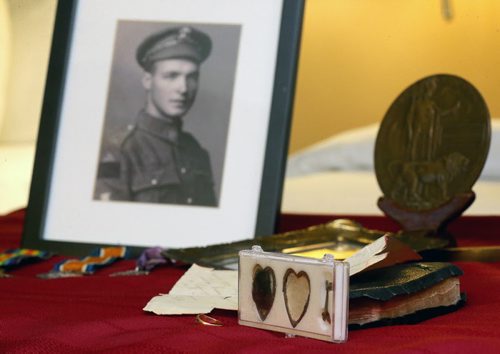 Jim and Patricia Halliday, from near Boissevain, with a locket, medals, bible, letter, and photos that belonged to Private Sidney Halliday, who was killed in the First World War and will have a lake named in his honour, Wednesday, January 13, 2016. (TREVOR HAGAN/WINNIPEG FREE PRESS)