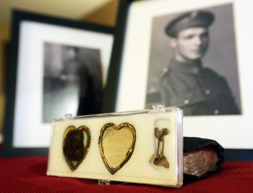 Jim and Patricia Halliday, from near Boissevain, with a locket that belonged to Private Sidney Halliday, who was killed in the First World War and will have a lake named in his honour, Wednesday, January 13, 2016. (TREVOR HAGAN/WINNIPEG FREE PRESS)