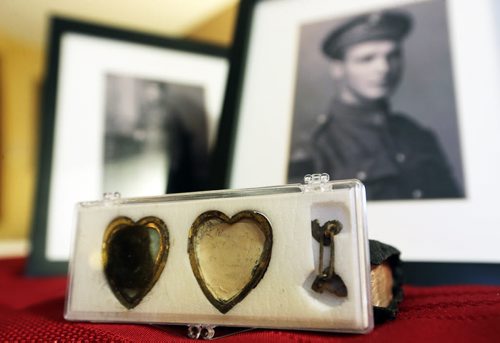 Jim and Patricia Halliday, from near Boissevain, with a locket that belonged to Private Sidney Halliday, who was killed in the First World War and will have a lake named in his honour, Wednesday, January 13, 2016. (TREVOR HAGAN/WINNIPEG FREE PRESS)