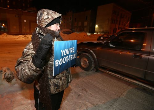 Harley Bray of Youth United thanks donors at the United Way Winnipeg Drive-Thru Boot Drive on Jan. 13, 2016 at United Way headquarters on Main Street. Donors who dropped off lightly-used children's boots were treated to free coffee and Jonnies Sticky Buns. The GenNext program, Koats For Kids and Grace Café were also involved in the event. Photo by Jason Halstead/Winnipeg Free Press RE: Social Page