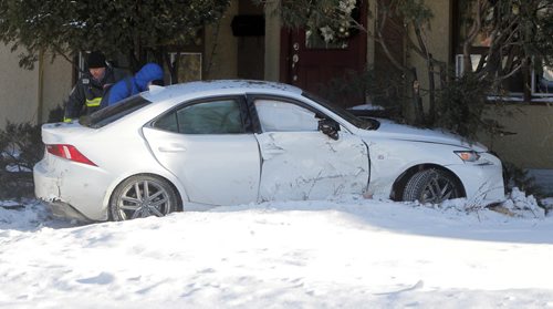 MVC Montrose and Corydon. 2 cars involved. No injuries. Car hit house. BORIS MINKEVICH / WINNIPEG FREE PRESS January 15, 2016