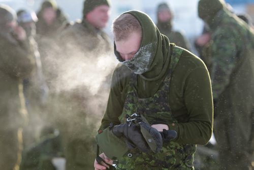 100-120 members of the military Arctic Response Company Group (ARCG) take part in an outdoor exercise in Gimli Saturday to prepare for deployment to the Arctic, Feb. 12. Purpose of the exerciseis to familiarize the members with working in a harsh environment, realistic and challenging scenarios they will face while moving in the high north on a search and recovery mission. At the end of a hefty mission pulling heavy sleds through deep snow the troops take off layers to cool off even in cold temperatures. Jan 16, 2016 Ruth Bonneville / Winnipeg Free Press