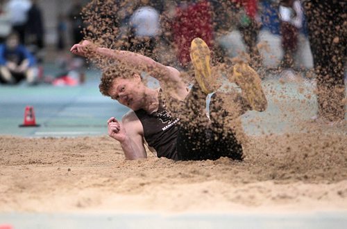 Adam Gundrum is sprayed with sand after his long jump while taking part in the Athletics Manitoba Winter Open Track and Field Meet at the James Daly Fieldhouse, Max Bell Centre, U of Manitoba Saturday.   Jan 16, 2016 Ruth Bonneville / Winnipeg Free Press