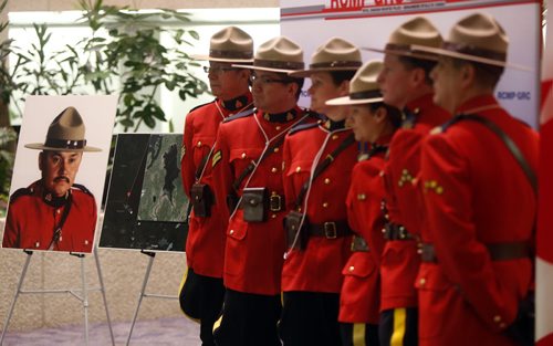 Members of the RCMP Honour Guard at the province's announcement Monday that a Manitoba lake will be named after RCMP Const. Dennis Strongquill (left), who was killed in the line of duty.   The ceremony was held Monday morning with members of the Strongquill family, Attorney General Gord Mackintosh and Assistant Commissioner Kevin Brosseau at the RCMP D Division HQ . Bill Redekop story. Wayne Glowacki / Winnipeg Free Press Jan. 18 2016