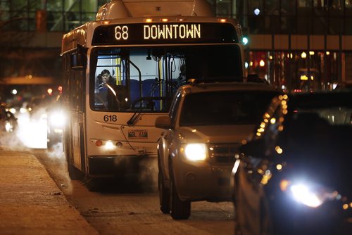 January 18, 2016 - 160118  -  Winnipeg city buses on Portage Avenue Monday, January 18, 2016. A code of conduct sticker will be placed on bus windows tomorrow. John Woods / Winnipeg Free Press