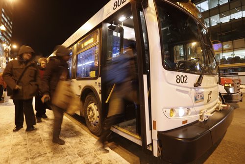 January 18, 2016 - 160118  -  Winnipeg city buses on Portage Avenue Monday, January 18, 2016. A code of conduct sticker will be placed on bus windows tomorrow. John Woods / Winnipeg Free Press