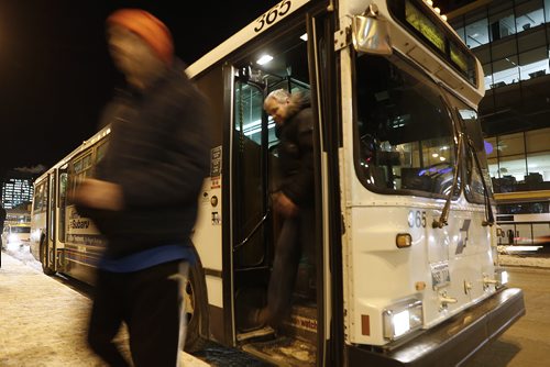 January 18, 2016 - 160118  -  Winnipeg city buses on Portage Avenue Monday, January 18, 2016. A code of conduct sticker will be placed on bus windows tomorrow. John Woods / Winnipeg Free Press