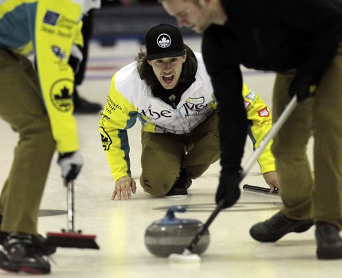 Skip Derek Oryniak roars delivering his rock Monday in the Free Press final at the MCA Open. See Tim Campbell's story. (Phil Hossack / Winnipeg Free Press)