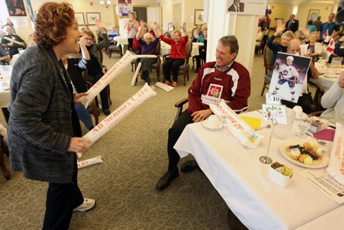 Sylvia Goodman a resident at the River Ridge Retirement Residence at 50 Ridgecrest Ave dances to "Hotline Bling"  a song by DRAKE in front of special guest former NHL player Laurie Boschman ( in red jersey) kicking off the 7th ASC Seniors Games. February 1st - 5th, 2016 where thousands of seniors will enjoy an environment of friendly competition while staying healthy and having fun during the winter months at 23 All Seniors Care Living Centres across Canada- Standup Photo- Jan 19, 2016   (JOE BRYKSA / WINNIPEG FREE PRESS)