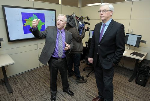 Premier Greg Selinger gets a tour of the new flood forecast by ADM Doug McMann Tuesday afternoon as Selinger completed a long list of Government announcements prior to a coming provincioal election. See Larry Kusch story. January 19, 2016 - (Phil Hossack / Winnipeg Free Press)