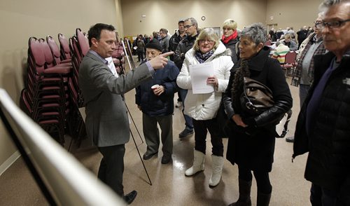 David Jopling (left) explains some of the options involved in the expansion of the William R. Clement Parkway at an open house and informational session in Charleswood Tuesday. See Ashley Prest story. January 19, 2016 - (Phil Hossack / Winnipeg Free Press)