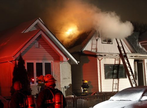 Winnipeg Fire Fighters at a house fire in the 1300 block of Alexander Ave. Wednesday morning. No one was injured, all occupants of the house got out safely, one of two cats inside was located and was fine. The fire started in the basement. Wayne Glowacki / Winnipeg Free Press Jan. 20 2016