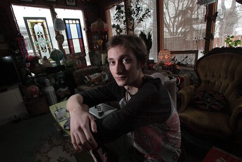 22 yr old Myles Keleher poses in his family home Wednesday afternoon. He was misdiagnosed with melanoma last year and underwent unnecessary surgery to remove lumph glands and more. He wants compensation for lost wages. See story.  January 20, 2016 - (Phil Hossack / Winnipeg Free Press)