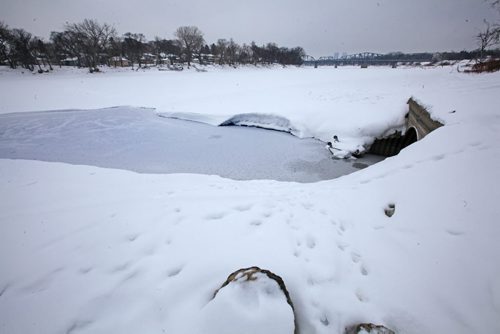 Culvert that opens into the Red River at St. John's Park on Main Street and Mountain Ave. View looking north east. View looking south,     See story on raw sewage emptying into the river.   Aldo Santin.  Jan 20, 2016 Ruth Bonneville / Winnipeg Free Press