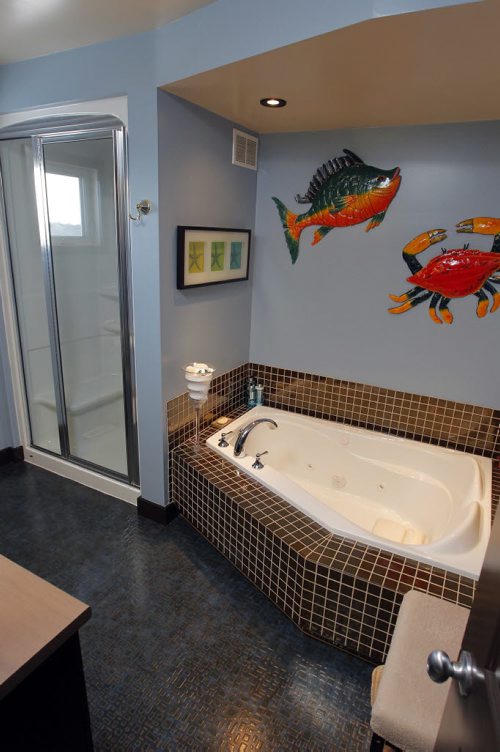 USED HOMES - 50 Sterling Avenue in St. Vital. Custom tiled bath area with fish theme. BORIS MINKEVICH / WINNIPEG FREE PRESS January 19, 2016