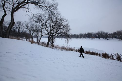 A man walks along the bank of the Red River near St. John's Park on Main Street and Mountain Ave. next to a culvert  that opens into the Red River which had raw sewage emptying into recently.    Se Aldo Santin story.  Jan 20, 2016 Ruth Bonneville / Winnipeg Free Press