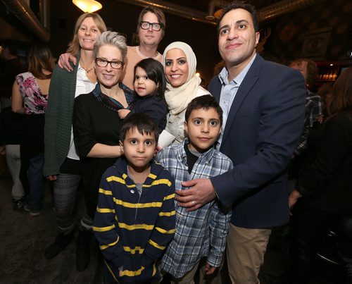 Clockwise from top left: South Osborne Syrian Refugee Initiative co-founder Sonya Jantz, initiative co-founder Matthew Lawrence, Joseph Chaeban, his sons Mohammad, 8, and Daham, 7, initiative co-founder Paula Hemsworth, Mila Chaeban, 3, and her mother, Zainab Ali, during the fundraising concert at the Park Theatre on Jan. 19, 2016, as part of the South Osborne Syrian Refugee Initiative to help refugee families come to Canada. Joseph Chaeban and his wife, Zainab, are living in Winnipeg and want to bring Zainabs brother and three young children to Winnipeg. They have fled to Lebanon while the war in Syria and Iraq rages on, while a cousin, Mohammad, and his wife and two youngsters escaped to Turkey. The event raised about $14,500 to bring the families to Winnipeg and help them get settled. The concert at the Park Theatre featured local acts the Bonaduces, Sweet Alibi and DJ Co-op. Photo by Jason Halstead/Winnipeg Free Press RE: Social Page