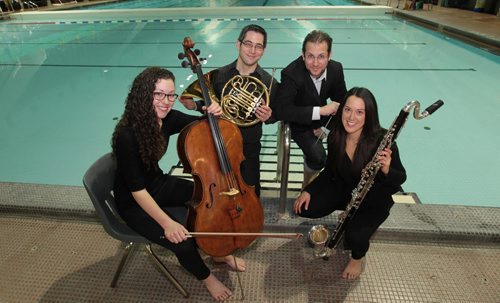 WSO Titanic photo shoot. Julian Pellicano - WSO resident conductor, with a few of the musicians (James Robertson- Horn, Leana Rutt Cello and Michelle Goddard - Bass Clarinet) and their instruments at Pan Am pool for preview photos to illustrate  their upcoming performance of the music from the Titanic taking place for one night only, Jan. 28 at the pool.  The Winnipeg Symphony Orchestra will transform the Pan Am Pool into a concert hall and perform The Sinking of the Titanic, a 1972 work by British composer Gavin Bryars inspired by the band that performed aboard the doomed ocean liner that sank in the North Atlantic in 1912. The event is part of the The 25th annual Winnipeg New Music Festival, which runs from Jan. 23-29. Jan 22, 2016 Ruth Bonneville / Winnipeg Free Press