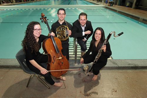 WSO Titanic photo shoot. Julian Pellicano - WSO resident conductor, with a few of the musicians (James Robertson- Horn, Leana Rutt Cello and Michelle Goddard - Bass Clarinet) and their instruments at Pan Am pool for preview photos to illustrate  their upcoming performance of the music from the Titanic taking place for one night only, Jan. 28 at the pool.  The Winnipeg Symphony Orchestra will transform the Pan Am Pool into a concert hall and perform The Sinking of the Titanic, a 1972 work by British composer Gavin Bryars inspired by the band that performed aboard the doomed ocean liner that sank in the North Atlantic in 1912. The event is part of the The 25th annual Winnipeg New Music Festival, which runs from Jan. 23-29. Jan 22, 2016 Ruth Bonneville / Winnipeg Free Press