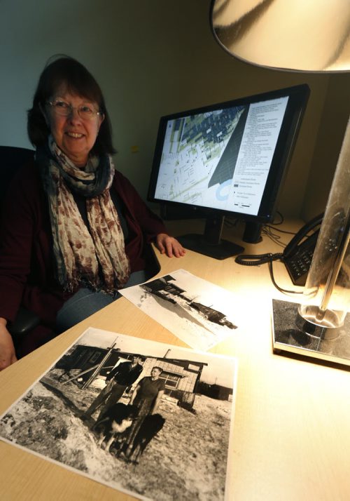 49.8 - Rooster Town. Evelyn Peters, a U of W prof. who's spent last few years researching Rooster Town and its inhabitants, who were mostly Metis and immigrant squatters living in shanties for decades. They were displaced in late 50s to make way for Grant Park shopping mall. She is with photos of  Rooster Town taken in 1950's, in the foreground is a photo Ernest and Elizabeth Stocks by their home. Randy Turner story Wayne Glowacki / Winnipeg Free Press Jan. 22 2016
