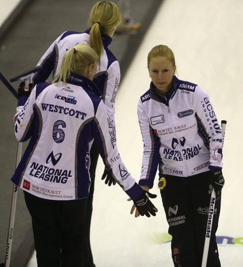 Kristy McDonald, right, celebrates with her Raunora Westcott and Leslie Wilson, during the 2016 Scotties Tournament of Hearts in Beausejour, Friday, January 22, 2016. (TREVOR HAGAN/WINNIPEG FREE PRESS)