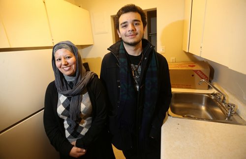 Nadia Ourrhi, life skills councillor from Welcome Place, mentoring Abdul Absuleh, Friday, January 22, 2016. (TREVOR HAGAN/WINNIPEG FREE PRESS)