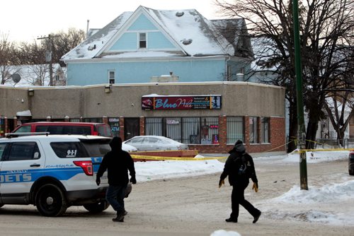 The entrance to Young Street off Sargent and the parking lot in the 500 block of Sargent at Young Street is taped off by police after a stabbing occurred early Saturday morning outside the Blue Nile Restaurant.    Jan 23, 2016 Ruth Bonneville / Winnipeg Free Press