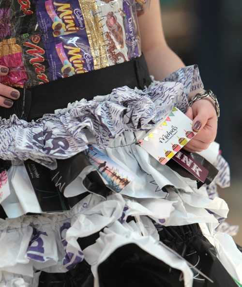 Grade 12 Collège Béliveau student, Kayla Acres, shows off her recycled dress she made out of plastic bags, candy wrappers and used gift cards that she plans on wearing to her grade 12 grad, at the Take Pride Winnipeg and Multi-Material Stewardship Manitoba Fashion Fest Saturday at St. Vital Centre.  Students from across Winnipeg showed off their outfits made out of recycled material as part of a educational program for students by MMSM to bring awareness to fun ways to reuse discarded materials.   Standup photos Jan 23, 2016 Ruth Bonneville / Winnipeg Free Press