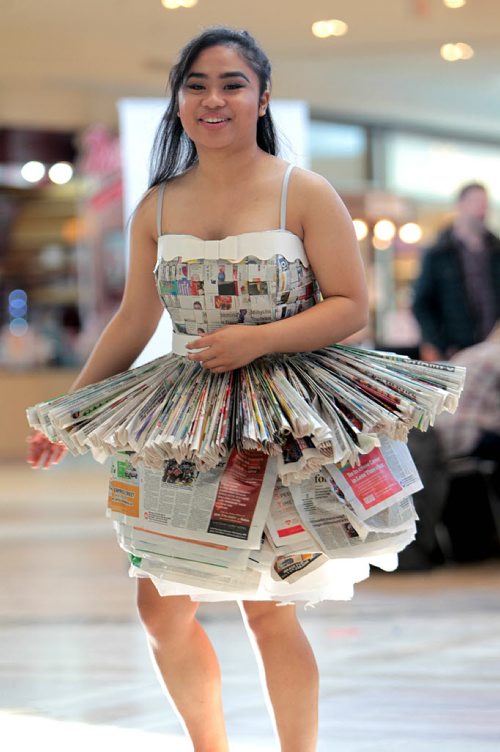 Grade 11 Elmwood High School student,  Michelle Nastor, shows off a recycled dress she help make along with classmates out of newspapers at the Take Pride Winnipeg and Multi-Material Stewardship Manitoba Fashion Fest Saturday at St. Vital Centre.  Students from across Winnipeg showed off their outfits made out of recycled material  as part of a educational program for students by MMSM to bring awareness to fun ways to reuse discarded materials.   Standup photos Jan 23, 2016 Ruth Bonneville / Winnipeg Free Press