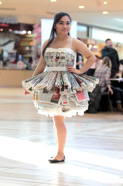 Grade 11 Elmwood High School student,  Michelle Nastor, shows off a recycled dress she help make along with classmates out of newspapers at the Take Pride Winnipeg and Multi-Material Stewardship Manitoba Fashion Fest Saturday at St. Vital Centre.  Students from across Winnipeg showed off their outfits made out of recycled material  as part of a educational program for students by MMSM to bring awareness to fun ways to reuse discarded materials.   Standup photos Jan 23, 2016 Ruth Bonneville / Winnipeg Free Press