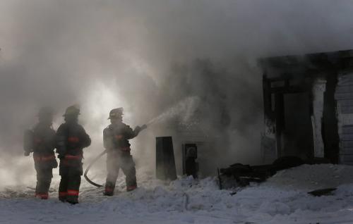 John Woods / Winnipeg Free Press / February 10, 2008- 08020810- Winnipeg firefighters work to extinguish a mobile trailer fire at 128 Augier Avenue in Downs Village Trailer Park February 10, 2008.