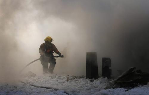 John Woods / Winnipeg Free Press / February 10, 2008- 08020810- A Winnipeg firefighter work to extinguish a mobile trailer fire at 128 Augier Avenue in Downs Village Trailer Park February 10, 2008.