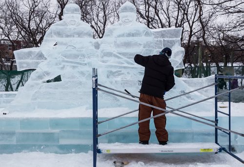 Workers continue to put the finishing touches on the Great Ice Show at The Forks Sunday before the area opens to the public on Monday. Workers were "testing" some of the slides before taking a lunch break. 160124 - Sunday, January 24, 2016 -  MIKE DEAL / WINNIPEG FREE PRESS