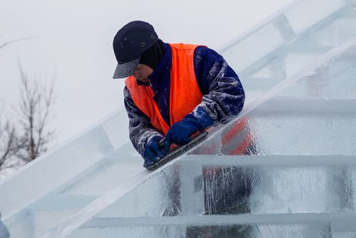 Workers continue to put the finishing touches on the Great Ice Show at The Forks Sunday before the area opens to the public on Monday. Workers were "testing" some of the slides before taking a lunch break. 160124 - Sunday, January 24, 2016 -  MIKE DEAL / WINNIPEG FREE PRESS