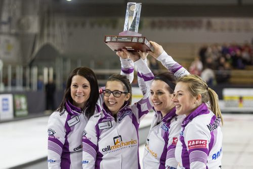 Skip Kerri Einarson (left) and her team (l-r), Selena Kaatz, Liz Fyfe and Kristin MacCuish react after receiving the winning trophy in the Scotties Tournament of Hearts against Team McDonald 7-4 in Beausejour, Manitoba, Sunday afternoon. 160124 - Sunday, January 24, 2016 -  MIKE DEAL / WINNIPEG FREE PRESS
