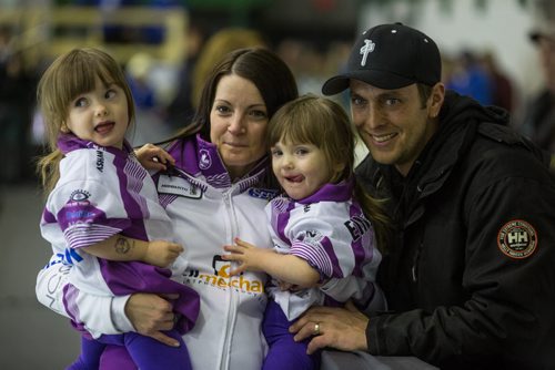 Skip Kerri Einarson holds her twin two-year-old girls Khloe and Kamryn with her husband Kyle after winning the Scotties Tournament of Hearts against Team McDonald 7-4 in Beausejour, Manitoba, Sunday afternoon. 160124 - Sunday, January 24, 2016 -  MIKE DEAL / WINNIPEG FREE PRESS