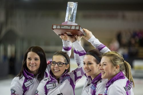 Skip Kerri Einarson (left) and her team (l-r), Selena Kaatz, Liz Fyfe and Kristin MacCuish react after receiving the winning trophy in the Scotties Tournament of Hearts against Team McDonald 7-4 in Beausejour, Manitoba, Sunday afternoon. 160124 - Sunday, January 24, 2016 -  MIKE DEAL / WINNIPEG FREE PRESS