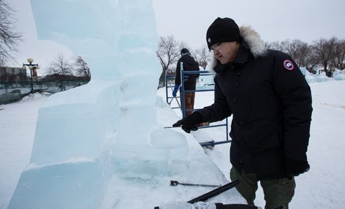 Andy Zhao helps to put the finishing touches on one of the ice sculptures at the Great Ice Show at The Forks Sunday before the area opens to the public on Monday. Workers were "testing" some of the slides before taking a lunch break. 160124 - Sunday, January 24, 2016 -  MIKE DEAL / WINNIPEG FREE PRESS