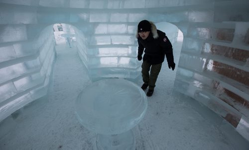 Andy Zhao walks inside one of the ice sculptures at the Great Ice Show at The Forks Sunday before the area opens to the public on Monday. Workers were "testing" some of the slides before taking a lunch break. 160124 - Sunday, January 24, 2016 -  MIKE DEAL / WINNIPEG FREE PRESS
