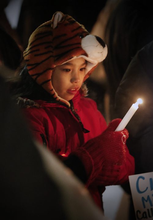 January 24, 2016 - 160124  -  Family and friends of missing woman Claudette Osborne gather for a vigil Sunday, January 24, 2016. Family and friends gathered on Selkirk at King St the last possible location Claudette Osborne was seen July 2008. John Woods / Winnipeg Free Press